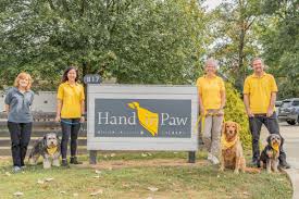 A high-resolution thumbnail for a California dog adoption blog featuring a happy family hugging a newly adopted Goldendoodle in a sunlit California park. The image includes bold, professional text overlays reading 